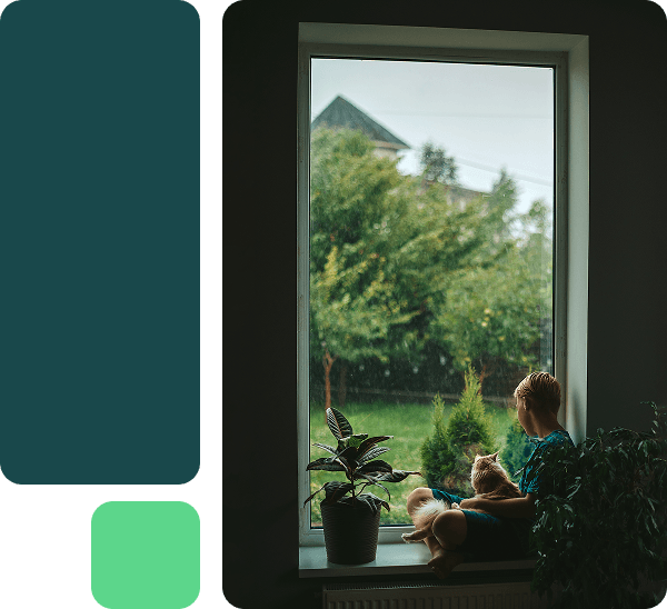 A decorative grid showing a photo of a boy looking out of his window 